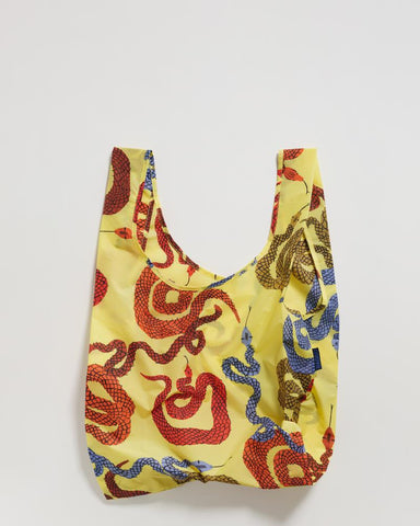 standard baggu yellow snakes reusable shopping bag holds up to 50lbs. can fit over shoulder. made from 40% recycled ripstock nylon