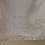 seven smooches white flowers embroidered at pillow slip bottom, 24 to 36 months