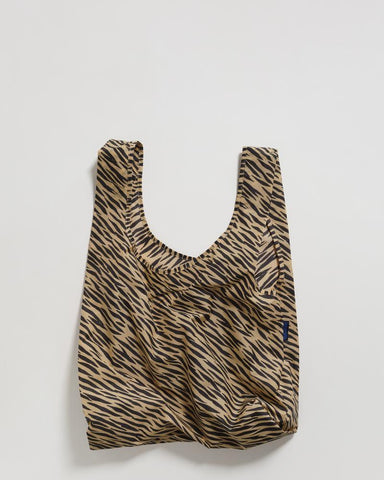standard baggu tiger stripe reusable shopping bag holds up to 50lbs. can fit over shoulder. made from 40% recycled ripstock nylon