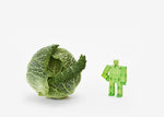 areaware green micro cubebot is a robot toy that can be assembled into countless poses and folds up into a cube