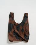 black and brown cow standard baggu reusable shopping bag holds up to 50lbs. can fit over shoulder. made from 40% recycled ripstop nylon