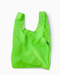neon green standard baggu reusable shopping bag holds up to 50lbs. can fit over shoulder. made from 40% recycled ripstop nylon