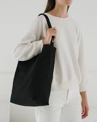 baggu black duck bag is made from 65% recycled cotton canvas machine wash or hand wash cold, line dry