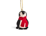 chilly penguin ornament is handcrafted from painted bread dough, in ecuador