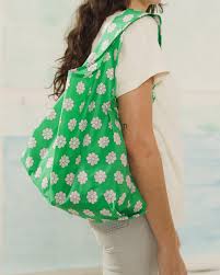 standard baggu green daisy reusable shopping bag holds up to 50lbs. made from 40% recycled ripstop nylon