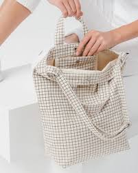 baggu natural grid duck bag is made from 65% recycled cotton canvas machine wash or hand wash cold, line dry