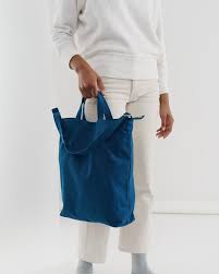baggu indigo duck bag is made from 65% recycled cotton canvas machine wash or hand wash cold, line dry