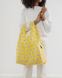 standard baggu yellow daisy reusable shopping bag holds up to 50lbs. made from 40% recycled ripstop nylon